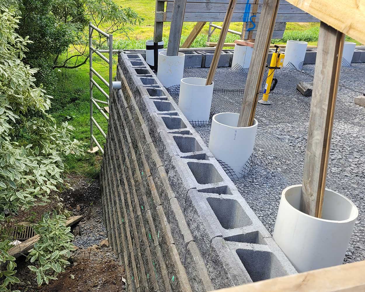 Structural engineer inspecting a retaining wall in Pukekohe, Auckland